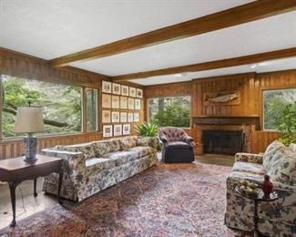 Floral upholstered sofas. Fine room size Oriental carpet (with minor damage)