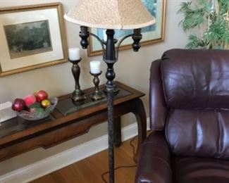 Heavy metal floor lamp.  Brown leather Man Size recliner with leather foot stool. 