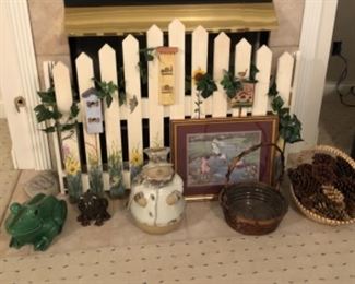 Home Decorations including a fireplace screen whimsically painted. Check out the large frogs and pottery snowman 