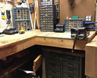 Workshop full of hand tools, power tools, and hardware. 