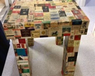 Side Table Covered in Match Book Covers