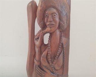 Hand carved wooden sculpture of  lady singer with amazing afro signed Emil