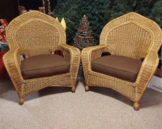 A pair of delightful wicker chairs in excellent condition with cushions