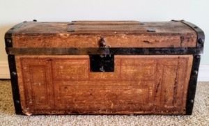 Vintage Wooden Trunk. There is some wear as pictured and the clasp looks to be broken. Measures 23.5” wide, 12” deep and 12” high.