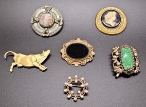 Variety of Brooches. A nice variety of styles! The largest measures about 2.5” in diameter.