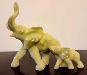 Carved Elephants. Unknown if jade or soapstone. Measures 6” wide and 5.5” high.