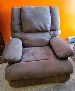 Mocha Microfiber Recliner. A very nice and comfy chair from Slumberland furniture. There is two small holes at the top where something was safety pinned, but is not noticeable. Measures 40” wide from arm to arm, 31” deep, 18” high to the seat and 39” high to the chair back.