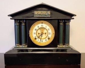 Vintage Ansonia Mantle Clock. This item was untested and unknown if in working order. There was no key, but can easily be replaced. Measures 15” wide, 6” deep and 12” high.