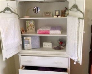 Pretty white armoire with baby things