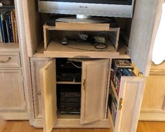 Drawers for VHS or dvd; TV nook with doors that close; Space for stereo system or VCR 