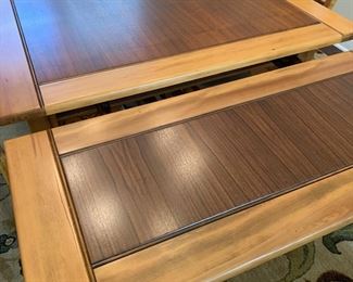 Leaf being extended on end of table