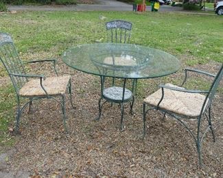 45" glass topped table and 3 chairs