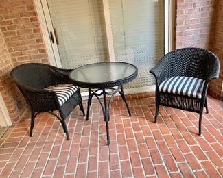 $295 - Lloyd Flanders/ Lloyd Loom premium wicker glass topped cafe table and two chairs with striped seat cushions. Table: 29"H x 30"D; chairs: 32"H x 27"W x 24"D (seat height 18"H)