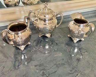 $95 - Forbes Silver Co USA (216). Large handled urn/sugar bowl: 6.5"H x 6.5"W x 4.5"D; Creamer: 4.5"H x 5.25"W x 4"D; sugar bowl: 4.25"H x 6"W x 3.5"W