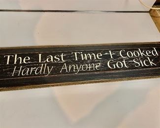 $30 - Wood plaque. "The Last Time I Cooked Hardly Anyone Got Sick" 7"H x 30"L
