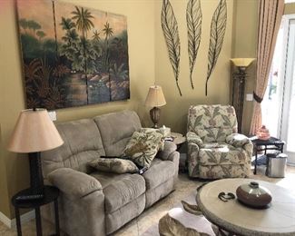 Picture behind love seat and table lamps