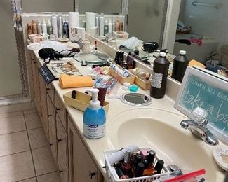 Assortment of Bathroom items including nail polishes