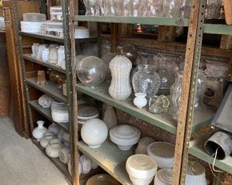 Multiple milk, frosted and clear glass globes and chimneys