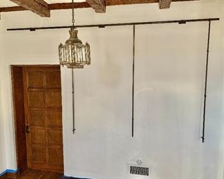 $395 - Wrought iron studio wall gallery/easel set.  One (1) Frame Rail; Three (3) vertical posts as shown; three hanging brackets.  ONE set available - $395 #2 (shown) 11’ rail.   Chandelier not for sale.