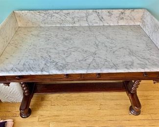$750 - Eastlake desk with marble top;  35"H x 48"W x 24"D