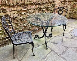 $495 - Cast aluminium patio / bistro table and two chairs; table 28" H x 36" diameter. Chairs 33" H x 17 1/2 W x 16 1/2" D. Height to seat 15 1/2". 