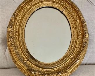 $50 - Vintage gilded oval mirror; 12” W x 14” H - as is - two distress cracks