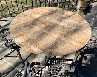 $800; Wrought iron table with limestone top;  table 2 (note condition)