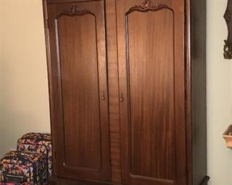 Large linen/clothing armoire on wheels.