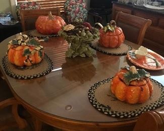 Dining table, six chairs on casters,includes additional leaf. Pumpkin soup tureens and ladles