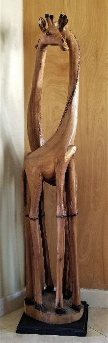 Tall wooden giraffes.