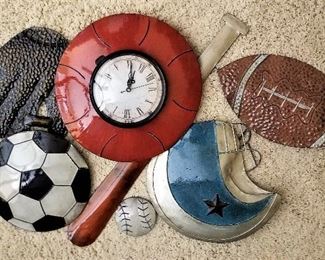 Basketball clock with soccer ball, football, and baseball wall decor for sports room or child's room.