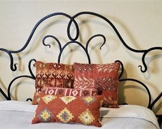 Aztec native American rust colored pillows and wrought iron queen bed for sale and queen mattress.