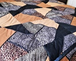 Queen leopard comforter set in blacks, silvers, browns and golden bronze.