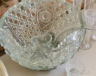 This thick glass/crystal punch bowl set features a glass ladle, beautiful bowl and 20 glasses, in original box!
