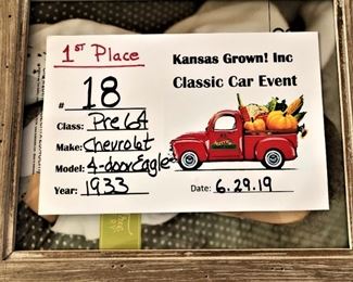 It has a reproduction rear trunk and dual front fender mounted spare tires.  The radio is one of the first production car radios although it doesn't work.  This model was the first year to have front and rear vent panes to allow for front through ventillation.