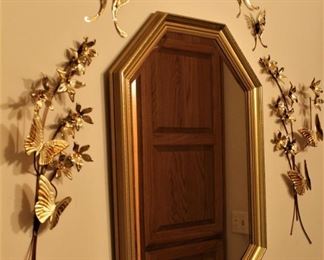 Ornate brass setting with mirror.