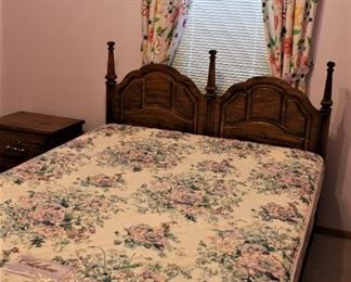 Queen size mattress and box spring with headboard.