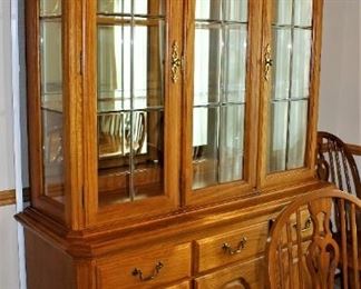 Beautiful lighted oak display hutch is in excellent condition.