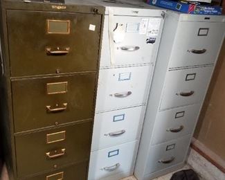Three file cabinets, the dark one is almost 100 years old with label and key.