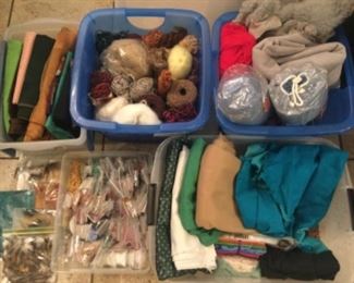 Felt pieces, feathers, suede skins, yarns, fabrics, beads