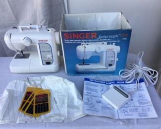 Singer featherweight sewing machine new in box with all manuals and accessories, note more machines will post