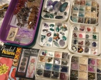 Cabochons, rock slices, stone and shell beads, books, 