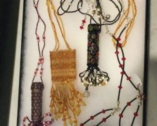 Neck pouches by artist, 