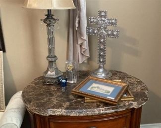 One of two marble top nightstands; crosses
