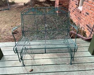 . .. a wrought-iron glider