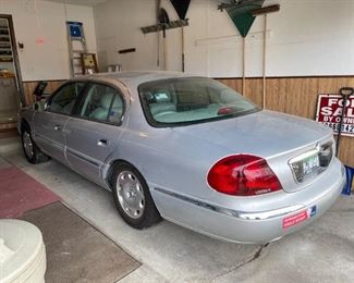 . . . 1999 Lincoln Continental with only 80,000 miles and in excellent condition!! Yes -- driven by a little old lady.