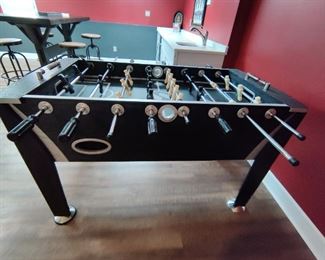 Brand - Sportcraft - Melbourne Foosball Table Features and Parts:
•	Full size foosball table
•	Steel foosball rods
•	Three-man goalie rod
•	Convenient side ball return
•	Bead style scoring on both ends of the table
•	Includes sanded foosball balls

Sportcraft - Melbourne Foosball Table Specs and Dimensions:

•	Length: 56 inches in length
•	Width: 29.4 inches in width
•	Height: 34.75 inches tall
•	Weight: 114 pounds
