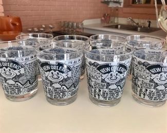 Set of 8 bar glasses with New Orleans theme designed by artist John Chase