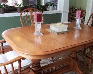 "Ethan Allen" Dining Room Table -Can Seat up to 12.  Table measures  59"L x 40"D x 30"H - has 4 additional 12" leaves that store in the table.