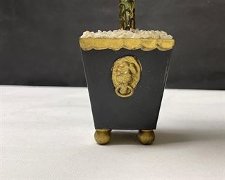 Tree candlesticks set in classical planter style bases with lion head ring handles, white stones, and ball feet.  Unknown origin